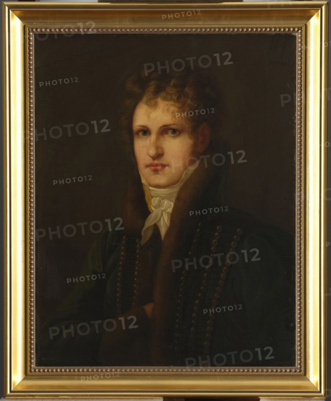 Portrait of Wlodzimierz Potocki 1789–1812, unknown Polish painter; after 1812. Shown to the bust, turned three-quarters to the left, looking straight ahead. A young, slender man with short blond hair combed over his face, with his right hand tucked into the lapel of a dark green uniform with a high stand-up collar and braided front. On each field, three vertical rows of round ochre buttons, between which black threads are laced horizontally. A white cravat is worn under the chin. The background is dark green, smooth. Smoothly painted, slightly idealized. Painting; Poland. Height 65.5 cm, width 52.3 cm. Maker: Brodowski, Józef 1781–1853 attributed/original author noted. Iconography: Potocki, Wlodzimierz 1789–1812; portraits of men; Napoleonics., A painted portrait of a person with light skin and curly brown hair wearing a dark green coat with a fur collar and a white neck scarf, shown from the chest up against a dark brown background; the subject has a neutral expression and is framed b...