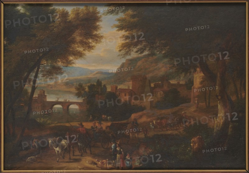 Landscape, Boudewijns, Adriaen Fransz. 1644–1719 painter, buildings, bridges architect, deposit provenance, horses, trees, carriages, Flemish painting, rivers, Priority 2 - visual documentation, landscapes, 17th/18th century, painting, height 33.3 cm, width 47 cm, A painted landscape scene shows a village by a river with a stone arched bridge spanning the water; the composition is framed by large trees with dense foliage on both sides, their leaves in shades of green and brown. In the middle distance there are clustered buildings and towers in earthy brown and ochre tones set against rolling hills and a pale sky with soft blue and warm yellow clouds. In the foreground a dirt road winds past figures and animals: a group of people wearing garments in muted reds, blues, and browns stand and walk, some near a cart drawn by dark horses, others leading a white horse. A few dogs move near the people. Vegetation in the foreground includes bushes and grasses in deep green and brown, and a tree ...