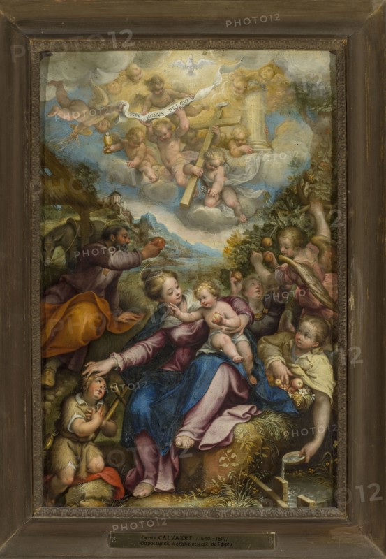 Rest during the Flight into Egypt, Denys Calvaert 1540–1619, painter; oil painting, 1590–1600; subject: religious scene depicting Mary, Joseph, the infant Jesus, angels, and John the Baptist; includes fruit and Arma Christi attributes; Netherlandish/Italian painting style; dimensions: painting 48.5 × 32.4 cm; with frame 62.2 × 45.7 × 5 cm; Antwerp artist's birthplace., A painted scene within a dark brown wooden frame shows a group of figures arranged in a vertical composition. At the top, a cluster of cherubic children with pale skin and golden hair floats on white and gray clouds, some holding a pale banner and a pale cross, and a white dove is overhead against a light blue sky. In the middle and lower areas, a seated woman with fair skin wears garments in deep blue, pink, and purple and holds a small child with fair skin and golden hair who is mostly nude; nearby, a man with darker hair and a beard leans forward wearing robes in brown and orange. Around them are several children and ...