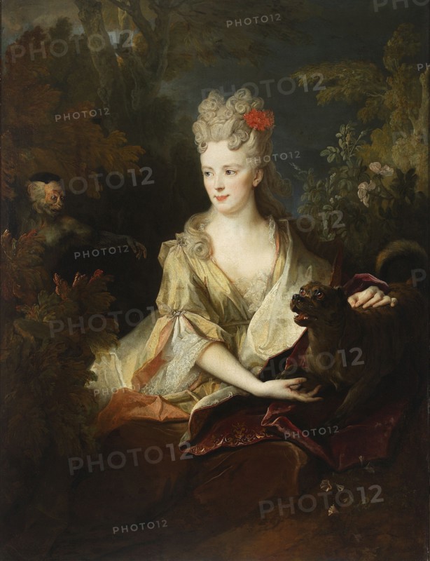 Portrait of a Lady with a Dog and a Monkey, by Nicolas de Largillière 1656–1746, French painting, portraits, female portrait, monkey, oil on canvas, c. 1700–1720; 135 × 106 cm., A seated woman with pale skin and powdered hair styled in curled updos with a red flower at the side wears a flowing silk gown in shades of cream, pale gold, and soft pink with lace trim; she looks slightly to her right with a calm expression and has one arm resting on draped fabric while the other reaches toward a dark brown dog with an open mouth and visible teeth that sits beside her on a deep red velvet cloth; behind her are leafy green and brown trees and bushes, and to the left among foliage a small monkeylike creature with a pale face and dark fur peers out, its arm extended; the overall palette includes cream, gold, pale pink, red, brown, green, and dark gray tones.