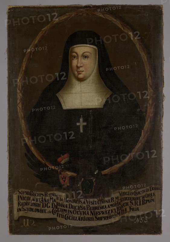 Portrait of Zofia Radziwillówna post 1672–post 1690, Visitationist nun, unknown Polish painter. Oval portrait surrounded by a laurel wreath inscribed within the image rectangle. Within the oval: half-length, turned slightly to the left, a nun in a black habit and a black veil worn over a white bonnet, close-fitting to the head, and in front with a plastron covering the neck. Oval, plump face with regular features. Around the neck is a cross with the IHS monogram. The background in the oval is gray-brown, smooth. The portrait rests on the back and outstretched wings of a black eagle with a princely mitre on its head and the Traby coat of arms on its chest. In its beak the eagle holds the Jastrzebiec coat of arms, and in its talons a white ribbon with a four-line Latin inscription identifying the portrayed person. The background outside the oval is gray-brown, a shade lighter than in the portrait. In the lower left corner, in white paint: 112, in the right: N 53. Dated 1733–1737. Oil on ...