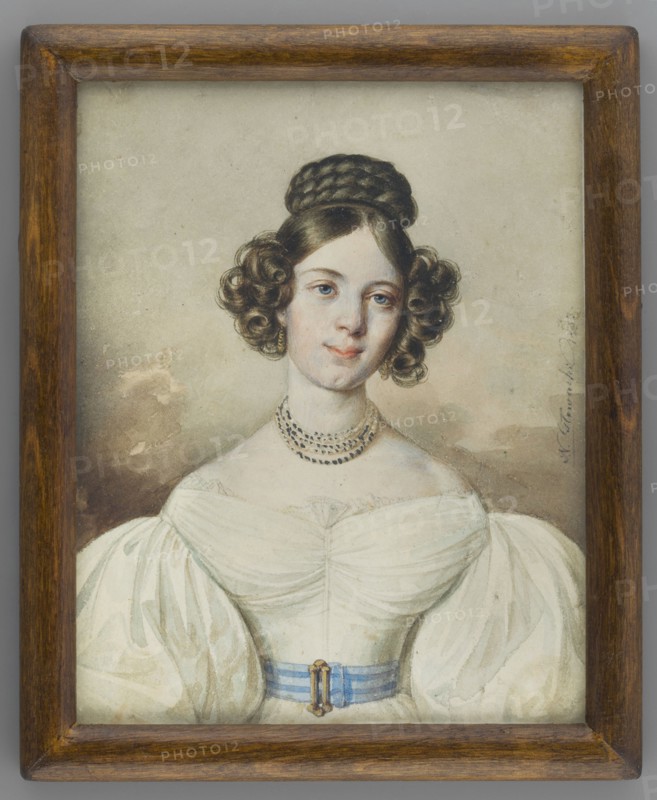 Portrait of Maria Radomyska, by Jan Nepomucen Glowacki 1802–1847. Miniature portrait, 1833. En face depiction: straight torso, head slightly turned to the right. Brown hair with curls at the temples and along the cheeks; braided crown at the top of the head. Gold earrings and a pearl necklace. White dress with a wide blue belt at the waist fastened by a gold buckle. Background brown-gray. Biedermeier style. Inscription on the back of the miniature period: Marya Radomyska / 1833 r. / rp Bizanskiego / in Kraków. Height 12.0 cm, width 9.5 cm. Secondary binding: narrow wooden strip., A framed portrait of a young woman shown from the chest up, wearing a white off-the-shoulder dress with large puffed sleeves and a light blue sash at the waist, her hair styled in dark brown braided coil on top and curled ringlets at the sides, a pale complexion with subtle rosy cheeks and blue eyes, a multi-strand dark necklace and small earrings, a neutral beige-gray background with some brownish shadowing, ...