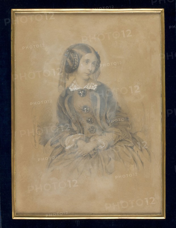 Portrait of a young woman in a crinoline – Seweryn née Potocka? 1795–1871 1st degree v. Izydorowa Sobanska 2nd degree v. Franciszkowa de Paula von Colloredo-Wallsee, Blaas, Karl von 1815–1894 painter. Young woman sitting in an armchair, visible below the knees, straight figure, slightly bent to the left, head 3/4 to the right, slightly tilted. Hair blonde, parted smoothly in the middle, wrapped back below the ears and held in semicircular braids on both sides. A transparent lace headdress decorated with blue buttons falls from the head. A white lace collar at the neck; a crinoline dress with round ribbon rosettes and pearl buttons. A velvet cape adorns the lapels of the wide sleeves with pleats sewn on from a different material. Hands casually crossed on the knees; thin bracelets with hanging topaz-colored stones on the wrists, and gauze cuffs peeking from the loose sleeves. Binding: a narrow triangular bronze strip with a sapphire velvet border; entire case made of dark blue leather. ...