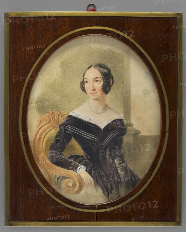 Portrait of Leontyna Eleonora Halpert 1803–1895, outstanding Polish theatre actress. By Stanislaw Marszalkiewicz 1789–1872. Seated figure nearly to the knees, head three-quarters to the left, torso slightly to the right. Black hair parted in the middle with braided side coils and a bun at the back; wearing a pearl necklace and a purple and black dress with lace at the bodice and cuffs. Right hand rests on the armrest of an armchair with an oval backrest. Background: grey-olive wall with a column and sky. Framed in a rectangular mahogany frame with an oval cutout and a bronze strip around the cutout; edges of the frame also trimmed with a bronze strip. Also notes: miniature; subjects include jewellery, women, portraits en three-quarters, dresses, interiors, theaters. Additional names: Eleonora Leontyna née Zuczkowski Halpert 1803–1895, wife of director Borys Halpert. Also associated names: Leopold Méyet 1850–1912; Maria Wodzinska 1819–1896, 1841. Dimensions: height 22.6 cm, width 18.3 c...