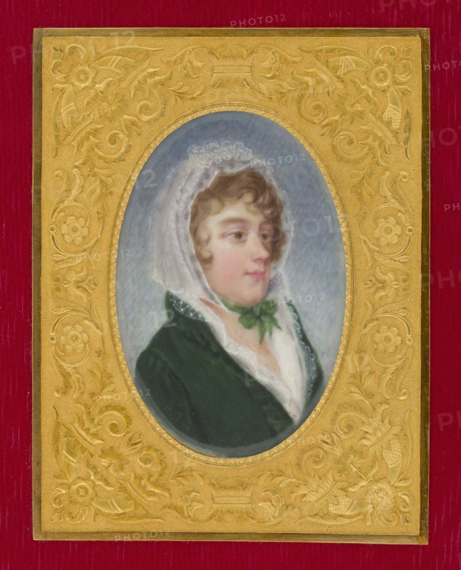 Konstancja Poniatowska 1759–1830, daughter of Kazimierz and Apolonia née Ustrzycka, wife of Ludwik Tyszkiewicz; miniature portrait, 1795, France. Bust facing right, almost in profile; white lace bonnet tied with a green bow under the chin, light hair in curls, dark green redingote, white shawl and blouse. Background: blue, sky. Gilded filigree frame in red morocco pocket book. Size: height 5.4 cm, width 3.7 cm., An oval portrait of a person wearing a white lace head covering and a dark green garment is centered within an ornate gold frame set against a deep red background; the person has light skin, short curly brown hair, and a green ribbon tied at the neck, with soft shading of pale pink on the cheeks and lips and a muted bluish-gray backdrop inside the oval, while the gold frame features raised floral and scrollwork decorations in warm yellow-gold tones.