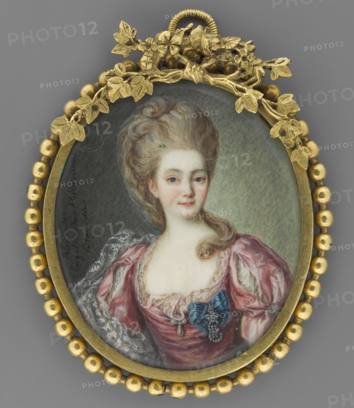 Aleksandra Branicka née Engelhardt 1754–1838, after Dymitr Lewicki 1735–1822, wife of Hetman Franciszek Ksawery Branicki, depicted as a Lady of the Order. Miniature portrait, en face, copy; subjects: aristocracy, woman, female portrait; details: orders, dress, hairstyle. Painted 1820, Russia. Miniature dimensions: height 7.4 cm, width 6.8 cm., A painted oval portrait set in a decorative gold frame with a beaded outer edge and a leafy floral ornament at the top shows a woman with pale skin and powdered hair styled high with soft curls; she wears a low-necked dress in shades of pink and mauve with white lace trim and a blue ribbon and jeweled ornament at the bodice, and her expression is calm with a faint smile. The background behind her is a muted gray-green. The frame and decorative elements are gold, and the dress and ribbon introduce pink, mauve, white, blue, pale skin tones, and muted gray-green.