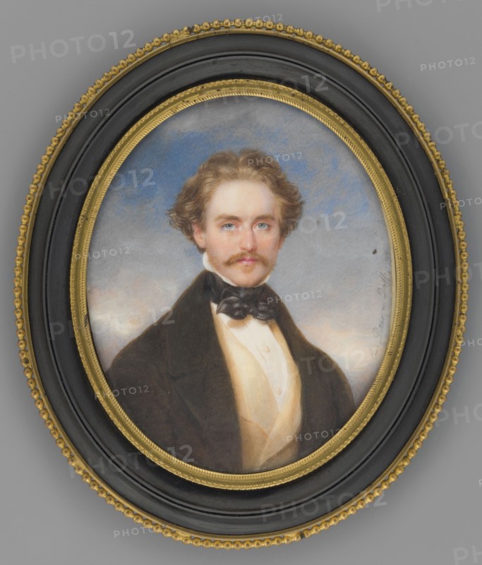 Adam Potocki 1822–1872, son of Artur and Zofia née Branicka from Krzeszowice; after a miniature by Moritz Daffinger 1790–1849 and Emanuel Peter 1799–1873. Half-figure, en face portrait of a man 3rd right, head almost straight: blond hair and mustache, white shirt, black cravat tied with a bow, sand waistcoat, dark brown frock coat. Background: sky with lilac-blue clouds, lighter at the bottom. Ornamented oval frame of gilded brass with pearling all around, bow at the top fastened with a flower, ring for hanging, support. Inscription on the reverse likely made by Katarzyna Potocka or at her request; she and Zofia Potocka organized the Potocki family archives. 1850, Vienna. Miniature; height 9.3 cm, width 7.5 cm., An oval framed portrait of a man with light brown wavy hair and a mustache, wearing a dark coat, a black bow, and a light-colored waistcoat, set against a cloudy sky background; the frame is black with gold decorative inner and outer rims. Colors visible include brown, black, g...