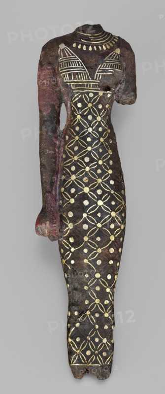 Figurine of a goddess, Figurine of a standing woman in a narrow dress with straps. The dress is decorated with a mesh motif with rhombus dots; the straps are decorated with vertical and horizontal stripes. A necklace is worn on the neck. The head, feet, and left hand are missing; the right hand hangs alongside the body. Possibly Neith mythology? c. 945–c. 715 BC; Third Intermediate Period, 22nd Dynasty, Egypt. Terracotta? material unspecified. Figurine; height 11.3 cm, width 3 cm, weight 0.19 kg., A slender headless and armless torso-shaped object with one partial arm remaining, rendered in dark brown and black tones with areas of reddish and greenish discoloration, decorated across its front with a repeating pattern of metallic gold circular dots and intersecting petal-like shapes, a gold-decorated bodice area with horizontal-striped triangular motifs, and a gold collar-like motif at the neck; the surface appears textured and worn with irregular edges and small holes, set against a pl...