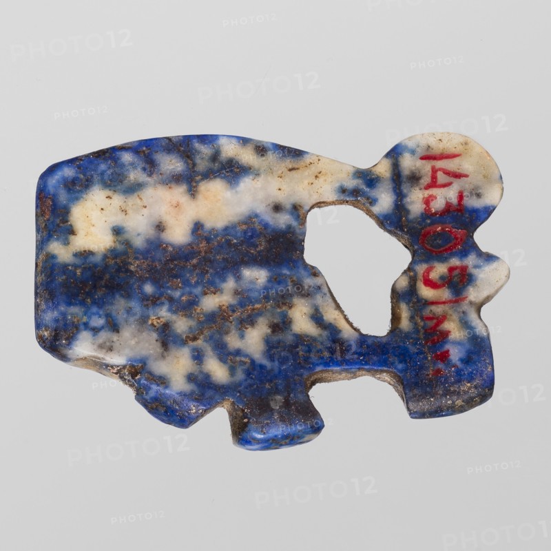 Amulet — Udjat eye with Uraeus;, Udjat eyes, Uraeus, Scen.Gal.Eg.; Egyptian religion; New Kingdom, 18th Dynasty, ca. 1550–1295 BC, Egypt; amulet; height 2.6 cm, width 1.7 cm., A roughly rectangular, irregularly shaped stone fragment with an organic cutout in the center and rounded protrusions along one edge, showing a mottled surface of blue, white, and brown tones, with some areas of darker blue and speckled brown discoloration.