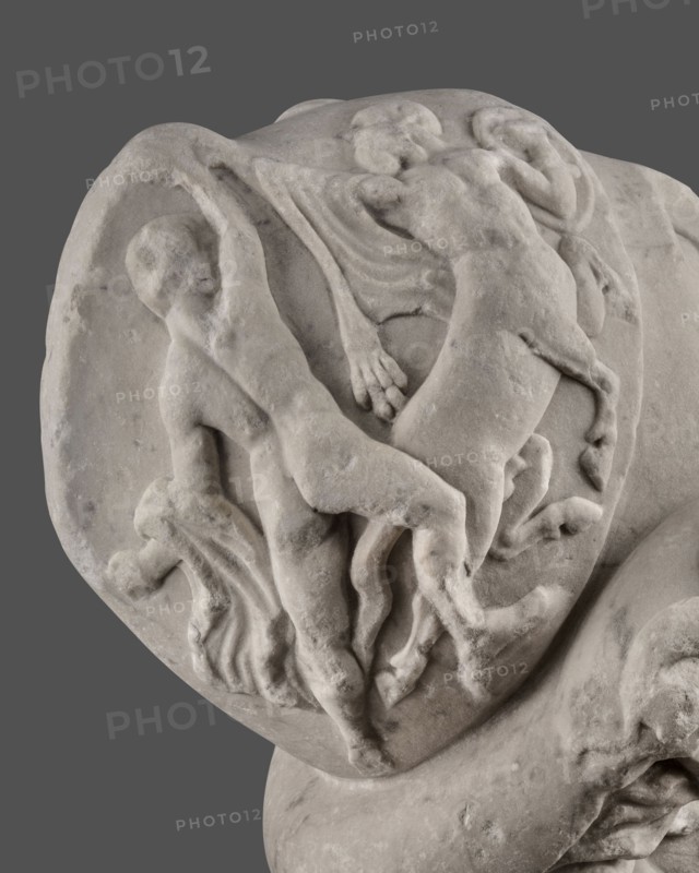 Head of Menelaus from the Menelaus Carrying the Body of Patroclus group. Head of a bearded man wearing a helmet, with an expressive face shown by wide-open eyes and parted mouth, emphasized by chiaroscuro effects from the contrast between lush locks of beard and hair emerging from under the helmet and the smooth skin of the face—the face of a man experiencing dramatic moments. The helmet is adorned with relief decoration depicting fantastic creatures: on each side a centaur fighting a Greek, and below, on the edge, a triton figurine. The sculpture is a Roman copy of the head from a Hellenistic bronze composition depicting Menelaus carrying the body of Patroclus. Menelaus, Helen's husband, is first to fight to retrieve the deceased's body and then carries it from the battlefield for burial; Patroclus’s death is an important moment in the Trojan War, bringing Achilles back into the fight and affecting the war’s outcome. Date: 1st half of the 2nd century AD reign of Hadrian, 117–138. Roma...
