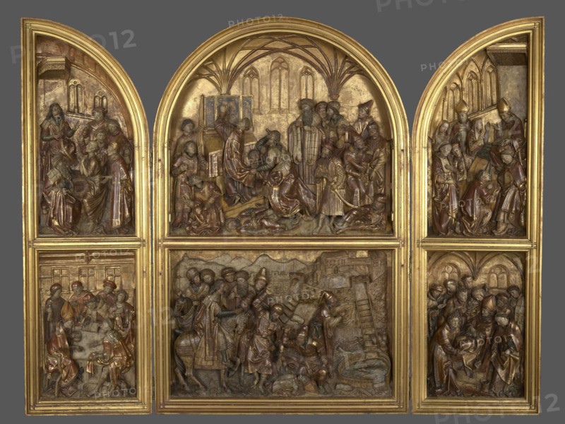 Triptych with the legend of St. Stanislaus, unknown sculptor, Hans von Kulmbach ca. 1485–1522 painter, legend of St. Stanislaus, Stanislaus of Szczepanów ca. 1030–1079, masterpiece, compare: brass crowns from the head of King Boleslaw secondary, crosier from the scene of the Murder of St. Stanislaus secondary, 1510–1520, Plawno parish church, Kraków place of origin, altar, bas-relief, A carved triptych with hinged side panels and a central arched panel, all set in a gold frame, showing detailed relief scenes populated by a group of figures in flowing robes and headpieces. The carving displays a palette of gold, brown, reddish-brown, and muted gray tones, with highlights of brighter gold on the frame and background surfaces. The upper central arched scene features several figures gathered under vaulted arches, some standing and some kneeling, with draped garments and varied headdresses. The upper left and upper right arched panels each contain groups of figures in similar robes and head...