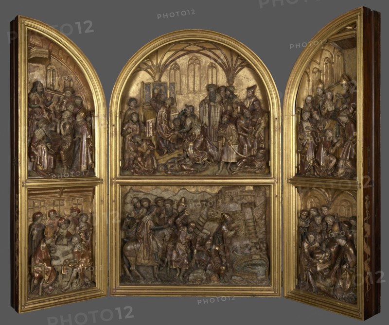 Triptych with the legend of St. Stanislaus, unknown sculptor, Hans von Kulmbach ca. 1485–1522, legend of St. Stanislaus, Stanislaus of Szczepanów ca. 1030–1079, Plawno parish church, Kraków origin, altar, bas-relief, 1510–1520, masterpiece, compare: brass crowns from the head of King Boleslaw secondary, crosier from the scene of the Murder of St. Stanislaus secondary, A carved triptych with three arched panels and two lower rectangular panels, all set in a gilded frame, showing intricately carved figures and architectural elements in bas-relief. The carvings depict groups of people in expressive poses, some seated and some standing, arranged in scenes with arches, columns, a ladder, and a well or circular feature. The surface colors include gold on the frame and background, with brown and darker brown tones on the carved figures and architectural details, and subtle touches of red and muted green on some garments. The overall composition is symmetrical with ornate moulding separating t...
