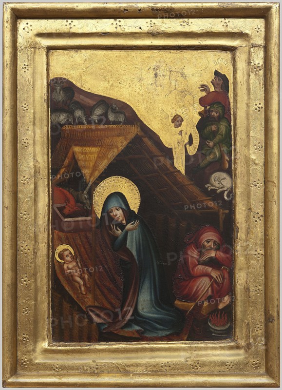Altar panels: Annunciation and Adoration of the Child, Franco-Flemish painter, provenance unknown, Annunciation of the Virgin Mary iconography, Adoration of the Child iconography, medieval art, probably wings of a home altar, ca. 1380, altar panels; Annunciation: height 40.0 cm, width 28.5 cm, thickness 3.0 cm; Adoration: height 39.5 cm, width 29.0 cm, thickness 3.0 cm., A painted scene bordered by a gold frame showing a small stable interior with a thatched roof and wooden beams, several figures and animals arranged inside and around it. In the foreground a woman wearing a teal-blue cloak and a gold halo kneels with hands raised toward a small infant lying on a cloth, the infant also shown with a gold halo. Nearby a seated figure in a red robe and head covering leans forward with arms crossed and a stick, a small fire with orange and red flames is beside them. To the left a wooden feeding trough and a donkey head are visible, and above the roof a group of sheep in shades of gray and w...