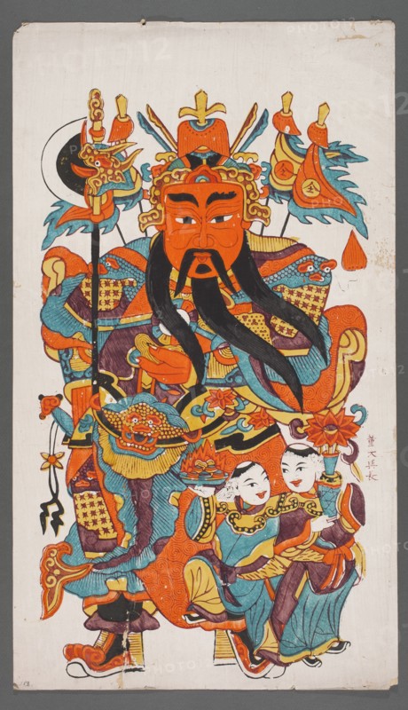 Menshen — the gate guardian with deities He He; creator, protective deities iconography; Chinese; Chinese art; Menshen the gate guardian iconography; graphic print nianhua, New Year's picture; early 20th century; Jiajiang, China; graphic; height 71.0 cm, width 41.0 cm., A colorful painted figure occupies most of the vertical image, wearing ornate armor and a large headdress with decorative elements. The central face is orange with black facial hair and expressive eyebrows, and long black mustaches or beard strands extend downward. Surrounding the figure are patterned garments and accessories in bright orange, teal blue, yellow, and purple, with details in black and small areas of white. A crescent-shaped black and white element appears near the upper left of the headdress, and several flag-like ornaments with teal blue and orange shapes extend from the top. Near the lower right are two smaller human figures with pale faces wearing teal blue and orange clothing, holding floral or decora...