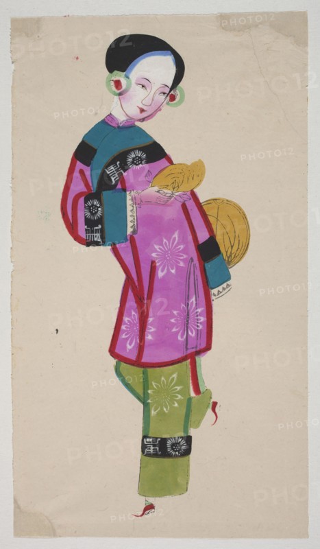 Dancing Beauty with Fruit and a Fan, unknown author, Chinese, early 20th century, nianhua New Year's picture, graphic print, height 44.5 cm, width 24.0 cm; subject: dancing figure with fruit and a fan; Mianzhu; theme: dances, fans, fruit., A standing figure wearing a colorful traditional outfit fills most of the image, with a pale beige background. The person has a smooth black hairstyle and a light skin tone with subtle pink shading on the cheeks. They wear circular green and red ear ornaments and hold a yellow handheld object and a round yellow item near their side. The upper garment is predominantly bright pink with darker pink outlines and white floral motifs, and it has teal blue and black sections on the shoulders and sleeves with decorative white patterns. The lower garment is green with lighter green floral motifs and black bands near the hem, and the footwear includes red details. Overall visible colors include pink, green, teal blue, black, yellow, red, white, pale skin tones...
