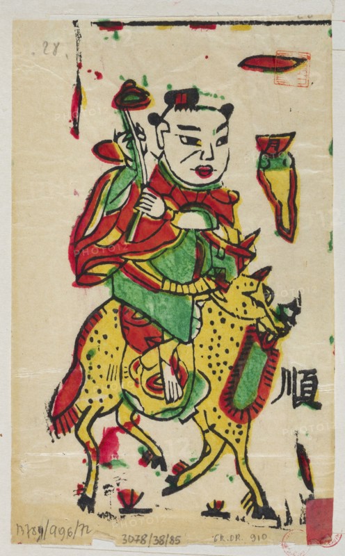 Boy on a mythical qilin, unknown author, Chinese, nianhua New Year's picture, early 20th century, Lingbao place of origin, graphic print, height 18.0 cm, width 10.5 cm; iconography: qilin., A stylized painted figure with a pale face, black hair styled into two buns, and red lips wears layered garments in red, green, and yellow and holds a long staff topped with a rounded element; the figure rides a spotted yellow animal with black spots and a red and green saddle-like decoration, and both are outlined in bold black brushstrokes; the background is a light beige paper with scattered small splashes and smudges of red, green, and black ink, and there are a few small colored shapes near the edges.