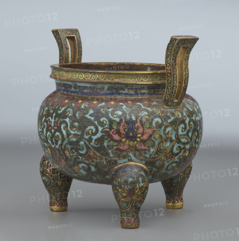 Ding-type incense burner with cover, Chinese, Qing dynasty Qianlong period, 1736–1795, ceremonial ding-type censer decorated with lotus plant ornament, bronze incense burner vessel, height 11.5 cm, diameter 11.0 cm., A rounded tripod vessel with two upward-curving handles, decorated overall with ornate swirling floral and foliate patterns in a palette that includes turquoise, green, blue, pink, red, gold, and touches of purple, set against a darker base; the rim features a band with a geometric border in blue and gold and a scrollwork band in green and gold, while the body displays stylized lotus-like flowers outlined in gold and interlaced scrolling vines; the three short legs continue the same decorative motifs and colors, and the handles are highlighted with gold interiors and green and gold ornamentation on their outer faces; the surface shows areas of worn patina and subtle variations in color and texture.