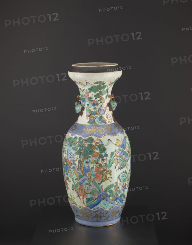 Vase, figurative scenes, Chinese art, Chinese culture, colored porcelain, warriors, plant ornaments, ceramics, decorative vessel, pumpkins, knightly scenes, Qing dynasty 1644–1911, Tongzhi period 1862–1874, foot and arms decorated with applied plastic decorations, 2nd half of the 19th century, China, vessel, height 62.5 cm, diameter 26.5 cm, A tall ceramic vase with a flared neck and rounded body sits against a dark background, decorated with intricate painted scenes and applied elements. The vase displays a palette that includes white, blue, green, turquoise, red, brown, gold, and black. The neck area is primarily white with painted figures and a green tree motif, and it has a dark brown rim and small turquoise-green applied ornamentation on either side. The main body shows a continuous painted landscape with groups of figures, trees, hills, and flowing decorative bands in blue and green, with red and turquoise garments and brown and gold accents. The lower section features a blue ban...