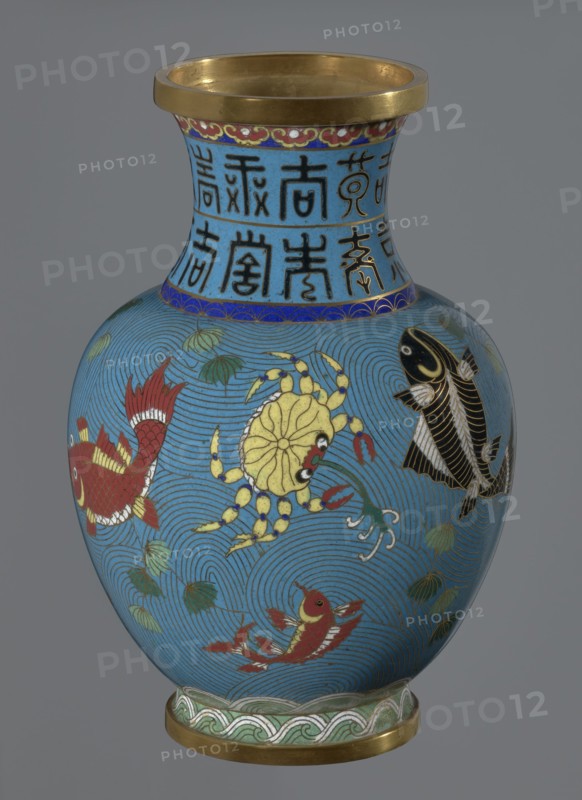 Vase, gift; Chinese; Qing dynasty 1644–1911; cloisonné enamel; vase on a foot with a neck; decoration: fish and crabs on a turquoise background, archaizing inscription on the neck; 19th century; China; vessel; height 23.2 cm, diameter 9.1 cm., A blue vase with a gold rim and gold base, decorated with a group of stylized aquatic creatures including a yellow crab, several red fish, and a black fish, set against concentric wave patterns and small green leaf-like motifs, with a band of blue near the neck containing dark vertical decorative marks and a narrow decorative border in red and gold below the rim.
