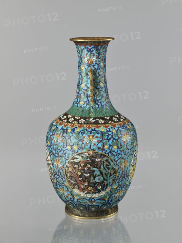 Vase, Paderewski, Ignacy Jan 1860–1941, Chinese art, Chinese culture, Qing 1644–1911, Qing style; motifs: lotuses, cranes, deer, peonies, chrysanthemums, zoomorphic motifs, meander ornament, lotus tendril ornament, tigers; cloisonné enamel; form: vase with a neck, two stylized handles on the sides of the neck; decoration: floral and plant tendrils on a turquoise background, birds and animals in circular medallions on a plant background; 19th century, China; vessel; height 33.0 cm, diameter 15.0 cm, weight 1.7 kg., A decorative vase with a flared rim and narrow neck opening into a rounded body, covered in intricate floral and scrollwork patterns in bright turquoise and deep blue, accented with gold and touches of red, black, white, and green; the neck shows swirling blue and gold designs with a vertical gold handle-like element, the shoulder is banded with a black and white floral motif above a green radiating pattern, and the body features circular medallions with darker backgrounds co...