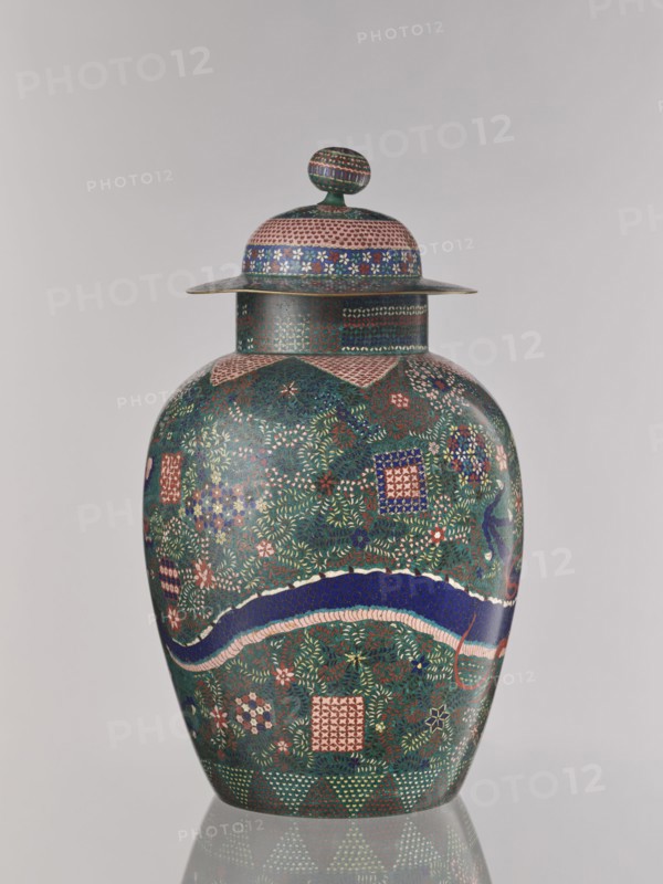 Vase with cover, Japanese, Edo 1603–1868 / Meiji 1868–1912, ca. 1860–1870, cloisonné enamel, covers, geometric-floral patterns, dragons Japanese dragon motif, floral ornament, shippo pattern, asanoha pattern, kikko pattern, Nagoya, Japan; vessel; height 55.5 cm, diameter 35.0 cm., A lidded vase with a rounded body and a flared rim ornamented in dense, repeated geometric and floral patterns in colors including green, blue, pink, red, and white; the lid has a domed top with a rounded knob decorated in matching motifs and colors, and the shoulder of the vase features a wide band and a curved wavy stripe in deep blue edged with pink, all set against a mainly green background with a few small accents of darker and lighter shades.