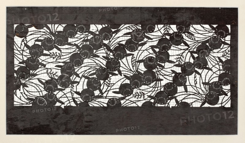Katagami dyeing stencil with pampas grass and rabbit motif susuki ni usagi, Japanese, Meiji period 1868–1912, ise-katagami stencil, chuban format, animals rabbit, grass motif, 19th–20th century, Japan; stencil; height 40.8 cm, width 24.2 cm., A rectangular artwork with a wide dark border surrounding an intricate cut-out panel filled with overlapping circular floral shapes and flowing curved stems and leaves; the cut-out area shows a contrasting light background behind the dark floral silhouettes, creating a repeating pattern of round flower heads with radiating petal details, elongated leaves, and winding tendrils; the colors visible are dark charcoal or black for the border and floral silhouettes, white or off-white for the background behind the cut-out, and a pale beige surrounding margin.