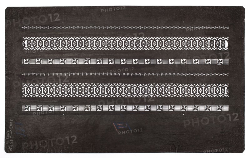 Katagami dyeing stencil; pattern of horizontal ornamental stripes; maker, geometric ornament; katagami stencil used in Japanese dyeing; Japanese; Meiji period 19th/20th century, 1868–1912; stencil; height 40.6 cm, width 24.7 cm., A dark rectangular sheet with a textured surface contains a series of horizontal decorative bands in contrasting light color. The bands include two wider repeating geometric lattice patterns, two narrower striped-and-square motifs, and two delicate dotted floral-like lines, all arranged in alternating sequence across the sheet. The sheet shows slight creases and worn edges, and there is a small area with faint colored marks in blue and red near the center bottom. The visible colors are dark brown or black for the background, white or light cream for the cutout patterns, and small touches of blue and red.