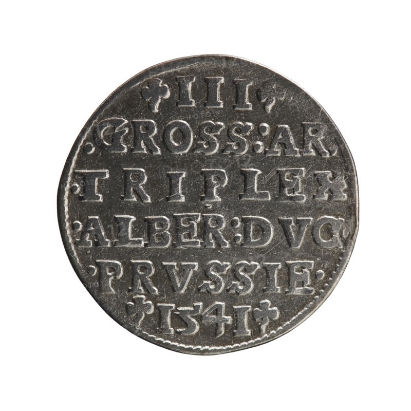 trojak, Decius, Jost Ludwik fl. 1528-1535 co-creator, Schilling, Maciej publisher, Albrecht Hohenzollern Prince of Prussia; 1490-1568 - iconography, trefoils, male busts in armour. Obv. Male bust in armour in profile turned to the right; short hair, long beard with sideburns. In the rim an inscription beginning with a trefoil -ALBER DG MAR BRAN DVX PRVS; pearl border, plant motifs between the words. Rev. In the pearl border there is an inscription in six lines -III-.GROSS:AR:/.TRIPLEX./.ALBER:DVC./.PRVSSIE./-I54I-; the denomination and date are between the trefoil marks. 1541, Ducal Prussia 1525-1701, Königsberg; coin; diameter 22.5 mm; weight 2.60 g; axis 220 degrees., A round metallic coin shown against a white background with a worn, slightly textured surface in shades of silver and gray. The coin displays a series of raised, blocky characters arranged in horizontal lines across its face, with visible scratches and small dents on the surface and along the rim. The edge of the coin i...