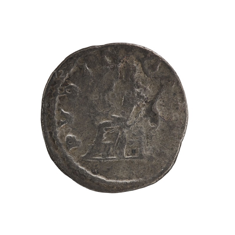 Denarius of Elagabalus reign 218–222. Obverse: IVLIA MAESA AVG — Draped bust of Julia Maesa facing right, pearl border. Reverse: PVDICITIA — Veiled Pudicitia seated on a throne facing left, raising the hem of her veil with her right hand and holding a scepter in her left, pearl border. Date: 218–223. Rome; Roman Empire. Coin; diameter 19.0 mm; weight 2.05 g., A round, worn coin with a rough, uneven surface and a dark gray to brown patina, showing a faint raised profile of a head on one side and an indistinct raised shape near the center; the coin edge is irregular and the overall appearance is aged and metallic with areas of lighter gray highlights and darker brown-gray shadows.