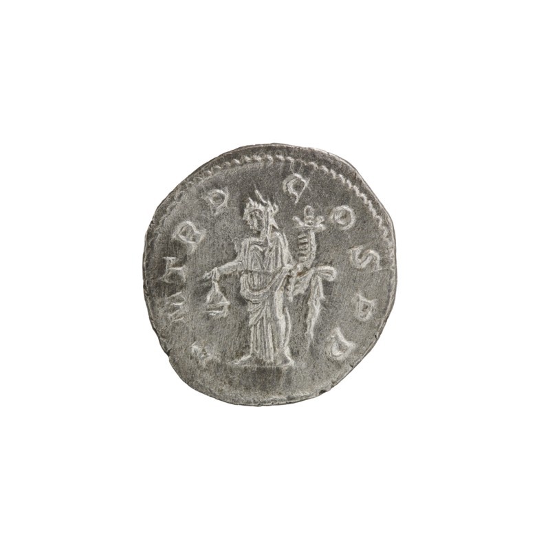 Denarius of Alexander Severus Roman emperor, 222–235. Obverse: Bust of Alexander Severus with laurel wreath and paludamentum facing right; pearl rim; inscription IMPCMAVRSEVALEXANDAVG. Reverse: Libertas stands straight with head to the left, holding a pileus in his right hand and a cornucopia in his left; pearl rim; inscription PMTR P C OSPP. Roman Empire, 222. Coin; diameter ~18.5–19.0 mm; weight 3.60 g., A circular metallic object with a worn gray surface showing a raised central design of a standing human figure draped in robes holding a small object in one hand, beside a taller vertical element with decorative details; the rim has a patterned border and the overall color is various shades of gray with lighter highlights on the raised areas.