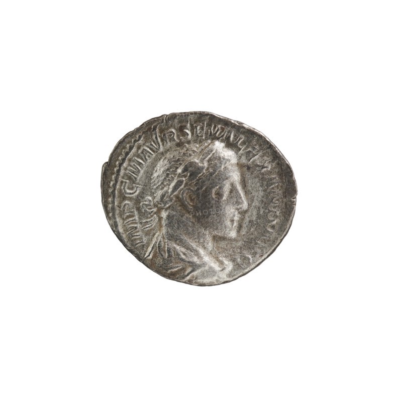 Denarius, Roman deities; Jupiter; Alexander Severus Roman emperor, 222–235 — iconography. Obverse: IMPCMAVRSEVALEXANDAVG. Bust of Alexander Severus with laurel wreath and paludamentum facing right; pearl rim. Reverse: PM TRPII COSPP. Jupiter naked in a cloak stands facing left, holding a thunderbolt in his right hand and a long scepter in his left; pearl rim. 223 CE, Roman Empire; mint: Rome. Coin; diameter 17.0–19.5 mm; weight 3.02 g., A round metallic object with a worn, textured surface showing a raised profile of a person facing right, surrounded by a raised rim and subtle decorative elements, primarily in shades of gray and silver with darker gray patina and lighter silvery highlights.