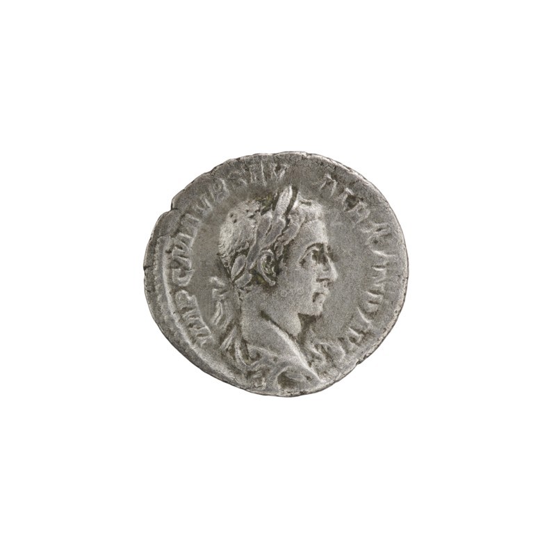 Denarius of Alexander Severus reigned 222–235. Obverse: Bust of Alexander Severus right with laurel wreath and paludamentum, pearl rim; legend IMPCMAVRSEV ALEXANDAVG. Reverse: Emperor in military dress standing straight, head turned left, holding a ball in his right hand and a spear in his left; legend PMTRPIII COSPP. Roman Empire, Rome, 224. Coin: diameter 17.5–19.0 mm, weight 2.70 g., A circular metallic coin with a worn textured surface showing a raised profile of a person facing right, with short hair and a laurel or similar headband; the coin displays a raised rim and a ring of shallow marks around the portrait. The visible colors are silver-gray with subtle darker gray toning and small areas of pale greenish discoloration.