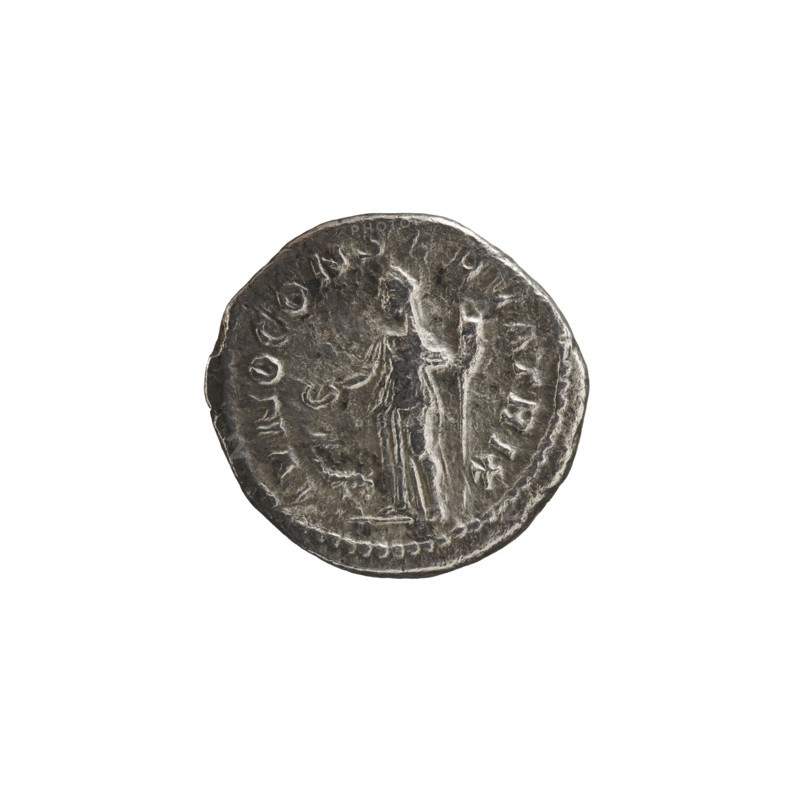 Denarius depicting Julia Mamaea ca. 180–235; Augusta 222–235 and Alexander Severus 208–235; Roman emperor 222–235; obverse: portrait/inscription identifying rulers; reverse: Juno myth., Roman deity. Iconography of Julia Mamaea 180–235. Date ca. 225–235 CE, Roman Empire, Rome. Coin denarius; diameter ~17–19 mm, weight 1.69 g., A round metallic coin with a worn, textured surface showing a raised central figure standing and facing sideways, with a draped garment and an extended arm; faint decorative edging runs around the rim and there are several raised shapes and markings around the figure. The visible colors are silvery gray with darker gray shadows and lighter gray highlights.