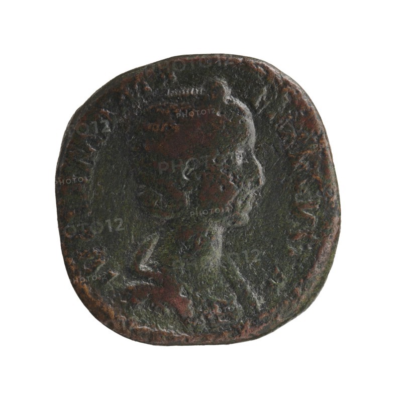 Sestertius of Alexander Severus 208–235; Roman emperor 222–235. Obverse: portrait of Julia Mamaea ca. 180–235; Augusta 222–235 — iconography related to Julia Mamaea; reverse: depiction of the Roman deity Venus. Date: 225–235 CE, Roman Empire; place of creation: Rome. Coin: diameter 28.5–29.0 mm, weight 18.7 g., A round, worn coin with a raised profile of a person facing right is shown against a white background; the coin surface has a textured, uneven patina with visible colors including dark green, brown, and hints of black, and the raised edges and portrait show areas of lighter wear and subtle reddish-brown tones.