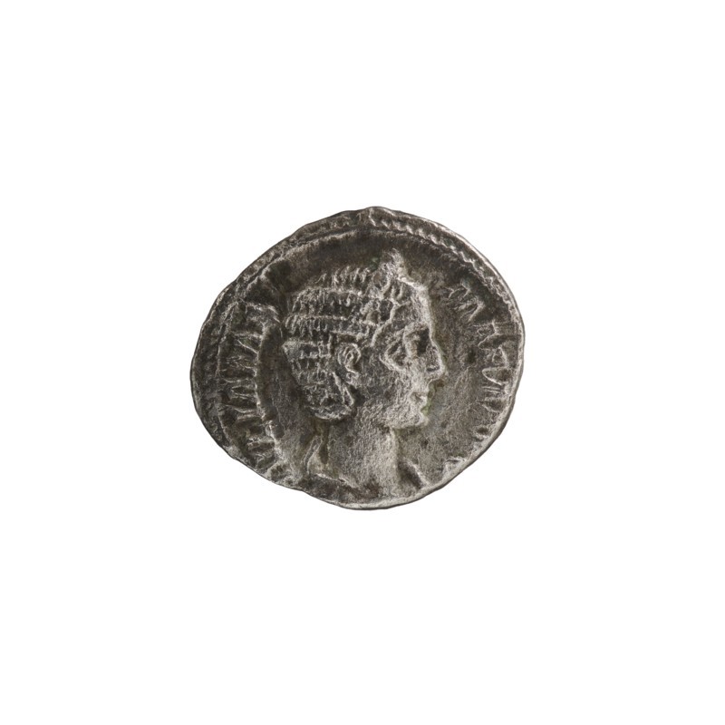 Denarius depicting Julia Mamaea ca. 180–235; Augusta 222–235 and Alexander Severus 208–235; Roman emperor 222–235. Obverse: portraits and inscriptions naming rulers and titles. Reverse: Vesta Roman deity iconography. Dated 225–235, minted in Rome, Roman Empire 27 BC–476. Coin; diameter approx. 17–19 mm, weight 2.70 g., A round metal coin with a worn surface showing a raised profile of a person facing right, featuring short textured hair and a visible ear, set against a recessed background; the coin's rim is slightly irregular and decorated with a repeating edge pattern, and the overall color is a mix of silver and gray with darker tarnished areas.