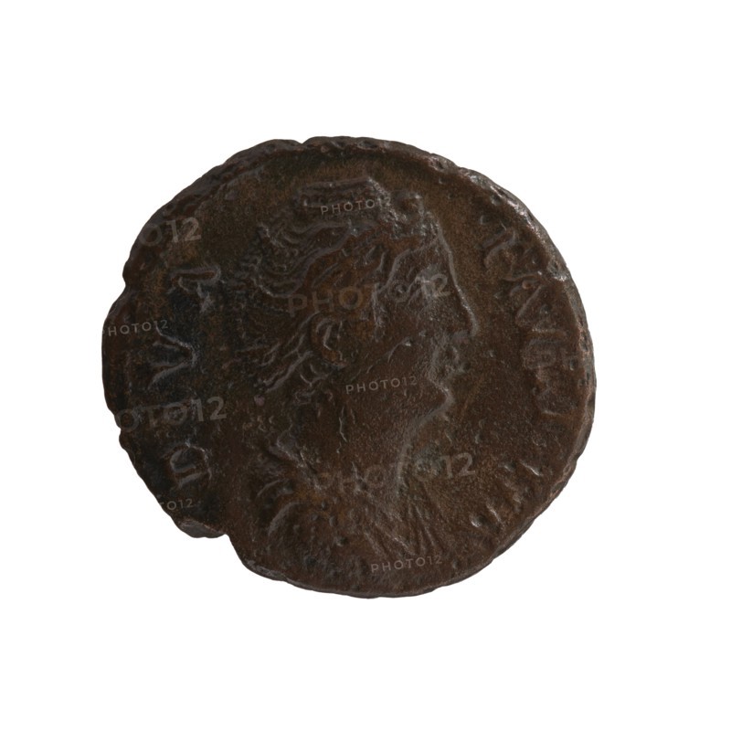 As/dupondius; Faustina the Elder 98–141, Roman empress 138–141 posthumous; Antoninus Pius 86–161, Roman emperor 138–161 issuer; obverse: Bust of Faustina I in drapery facing right, legend DIVA · FAVSTINA; reverse: Aeternitas personification in a veil sits on a star-studded globe to left, right hand outstretched, holding a scepter in left, legend A ETER N I T AS in the exergue; after 141, Rome, Roman Empire; coin as/dupondius, diameter 24.0–26.0 mm, weight 8.40 g, axis 180°., A round, worn coin with a dark brown and almost black patina showing a raised profile of a person's head in relief, with visible hair details and a faint suggestion of a laurel or headband, set against a lighter brown background on parts of the surface and irregular edge wear.