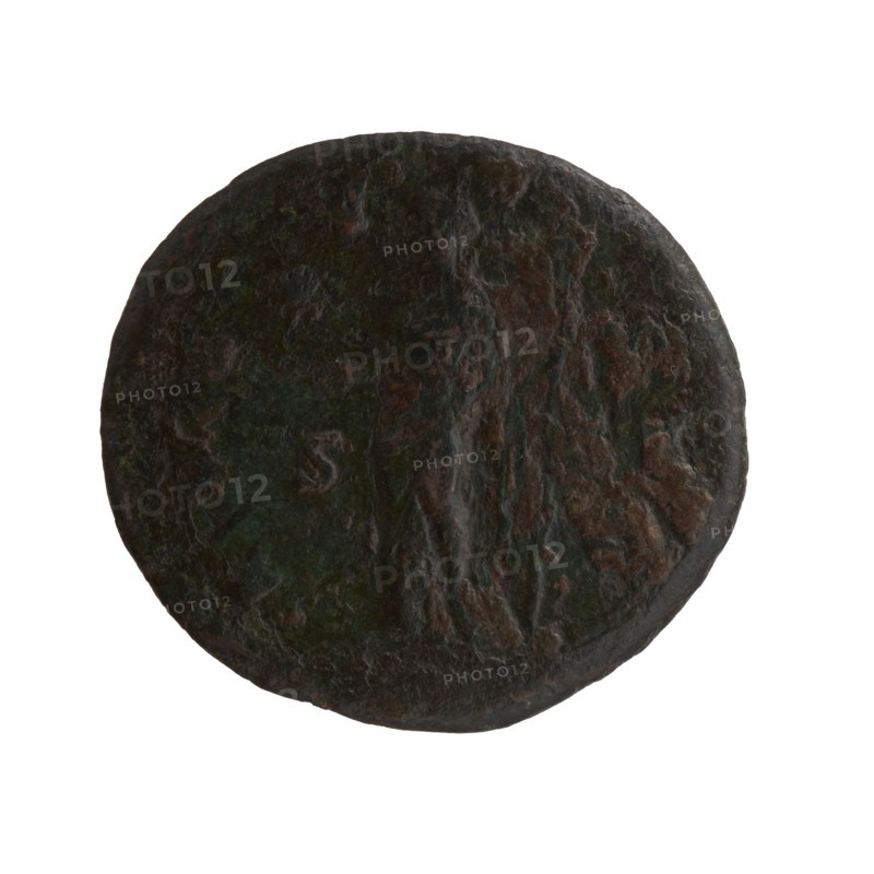 Dupondius/as, Faustina the Elder 98–141; Roman empress 138–141 posthumously, Antoninus Pius 86–161; Roman emperor 138–161 issuer. Bust of Faustina I in drapery facing right; inscription DIVA · FAVSTINA around. Reverse: Vesta standing left, holding a statuette of Athena palladium in her outstretched right hand and a long torch in her left; inscription A · VG · V · STA all around, in SC fields. After 141, Roman Empire, Rome. Coin; diameter 26.5 mm obverse, 28.5 mm reverse; weight 12.30 g; axis 0°., A round, weathered object with a rough, uneven surface showing a mix of dark brown, green, and black tones; faint raised and indented areas form an irregular pattern across the surface, and the edges are slightly worn and irregular.