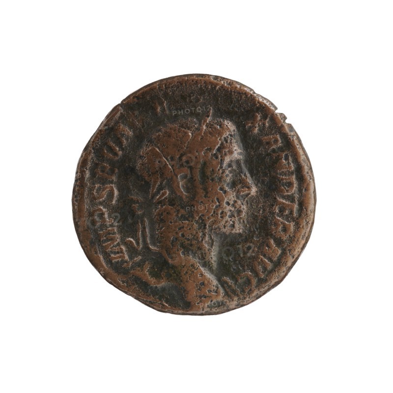 As forgery, Alexander Severus 208–235; Roman emperor 222–235 — personifications; Alexander Severus Roman emperor; 222–235 — iconography; Justitia personification; 230 for the original; Rome; Roman Empire 27 BC–476; coin, forgery; coin: diameter 24.5 mm, diameter 25.0 mm, weight 13.69 g, A round, worn metal coin with an uneven, textured surface showing areas of brown and dark brown patina, featuring a raised profile of a person's head in the center with visible facial contours and hair, and a raised rim around the edge with scattered raised markings; the coin's surface shows pitting and darker spots and the overall colors visible are brown and dark brown.