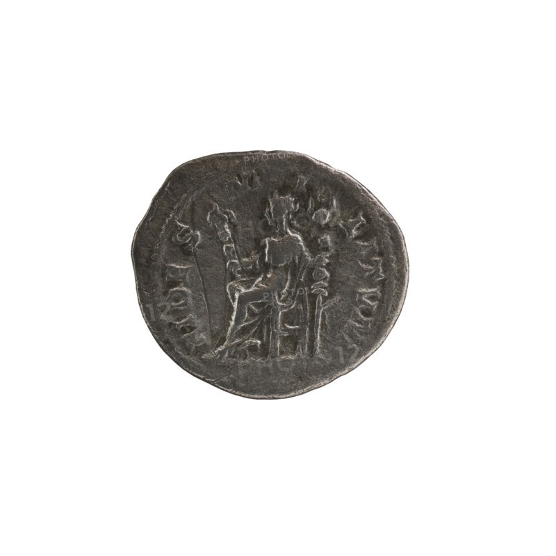 Denarius; personification: Fides Fidelity; Alexander Severus Roman emperor, 222–235 — iconography, 228–231; Roman Empire 27 BC–476, Rome; coin; diameter 18.0–20.0 mm; weight 2.71 g, A round, worn coin with a dark gray metallic surface showing a seated figure in relief at its center, surrounded by a raised border and faint decorative elements; the background around the coin is white.