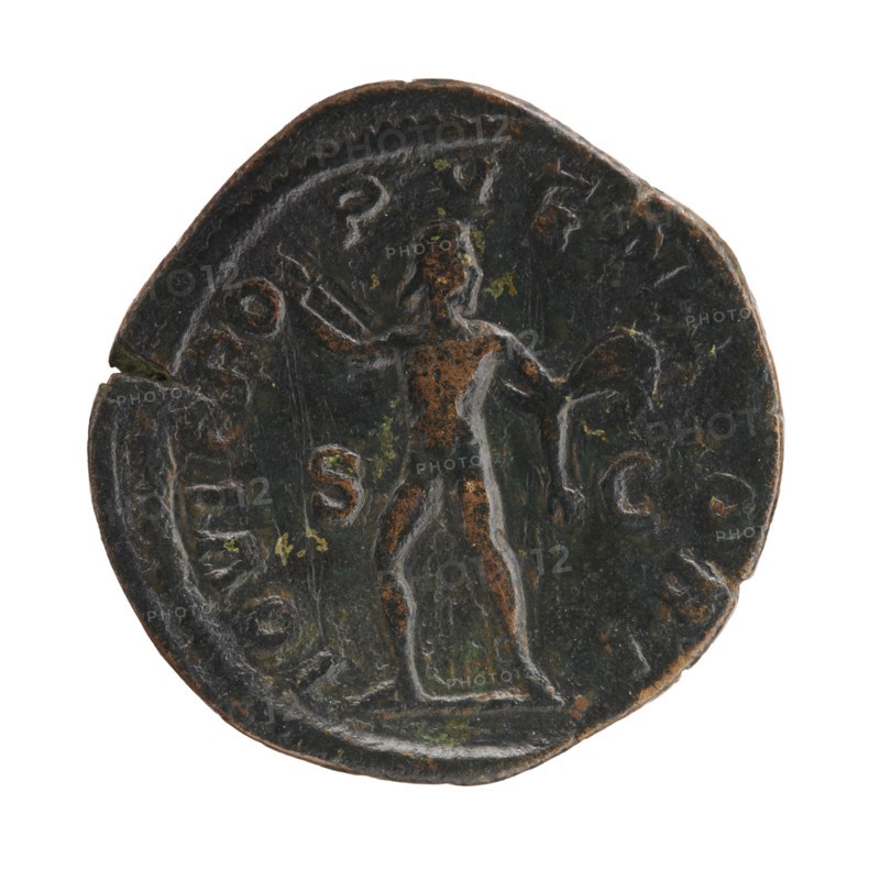 sestertius; Severus Alexander Roman emperor, ruled 222–235 CE; issuer: Severus Alexander; obverse: imperial titulature and portrait; reverse: Jupiter Roman deity iconography; date: 231–235 CE; place of minting: Rome, Roman Empire; medium: coin; diameter approx. 30–31 mm; weight 16.93 g, A round, dark metal coin with areas of brown and green patina showing a raised depiction of a standing human figure facing forward, with one arm extended and the other bent holding an object, the figure outlined in lighter worn edges against a darker background, and the coin edge irregular with a small nick.