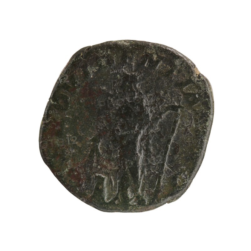 Sestertius of Severus Alexander reigned 222–235 CE. Obverse: bust/portrait of Severus Alexander Roman emperor 222–235. Reverse: personification Providentia. Date: 231–235 CE. Roman Empire; minted in Rome. Coin type: sestertius; material: coin. Diameter ca. 28–29 mm; weight 16.01 g., A round, irregularly shaped coin-like object with a rough, worn surface in dark green and brown tones, showing patches of lighter green and subtle reddish-brown areas; the surface has visible textured lines and shallow grooves, with a few raised and indented areas around the edges and central region.