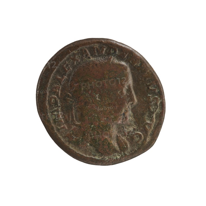 Alexander Severus 208–235; Roman emperor 222–235 issuer; Jupiter mythology; Roman deities; Alexander Severus — iconography, 231–235; Roman Empire 27 BC–476; Rome; coin; diameter 25.0 mm–26.0 mm; weight 8.98 g, A round metal coin with a worn raised profile of a person's head facing right, showing facial features and a short beard; the coin surface is uneven with patina and corrosion. The visible colors include brown, dark brown, greenish spots, and traces of reddish-brown. The coin edge is slightly irregular and the relief around the portrait is smoother and more worn than the surrounding rim.
