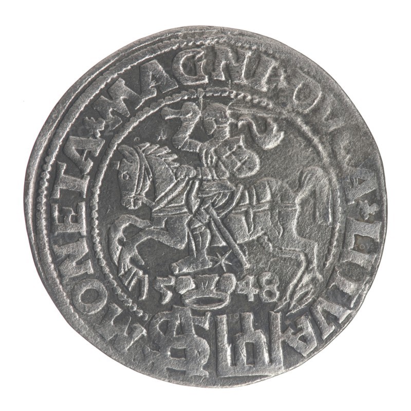 Lithuanian grosz on a Polish foot, Sigismund II Augustus King of Poland; 1544–1572. Polish coin, Jagiellon dynasty. Obverse: Crowned male bust in armor turned right, inscription in half-circle: SIGIS - AVG.REX; at bottom in two lines: . OLO.MAG/.DVX.L. Reverse: Lithuanian Pogon mounted knight turned left, under a crown dividing the date 15 - 48, a monogram of the letters SA and the Columns of Gediminas coat of arms, which divide the rim inscription: MONETA.MAGNI.DVCA.LITVA. Dated 1548. Minted in Vilnius Grand Duchy of Lithuania., A circular metallic coin with a worn, textured surface showing a raised central design of a horse and rider in profile, both rendered in relief with visible tack and armor details; the rider holds a long object and the horse's head and legs are distinct. Around the central scene is a raised decorative border and a ring of raised characters and symbols following the coin's edge. The coin's color is mainly silvery-gray with darker gray shadows in recessed areas ...