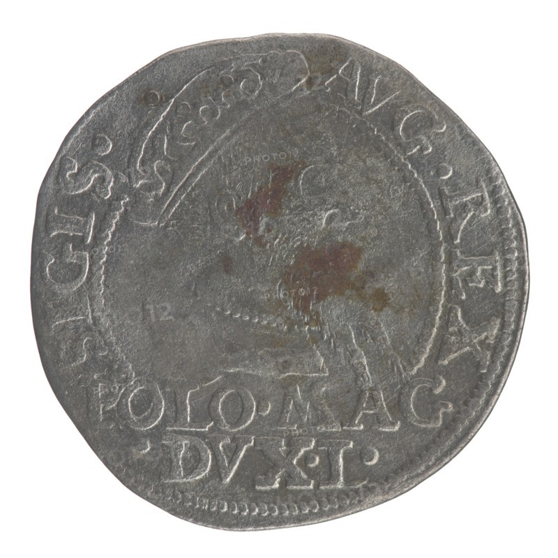 Lithuanian grosz on a Polish foot, Sigismund II Augustus King of Poland; 1544–1572 author, coats of arms, Jagiellons dynasty, Polish coins, royal bust iconography, SA monogram, Pogon coat of arms; Lithuania, tied monograms, Columns of Giedymin coat of arms of Lithuania, male busts, Sigismund II Augustus King of Poland; 1520–1572 - iconography, monograms. Obv.: Crowned male bust in armour turned right, separating an inscription in a half-circle at the top: SIGIS. - AVG.REX; at the bottom horizontally in two lines: POLO.MAG/.DVX.L. Rev.: Lithuanian Chase turned left; below, under the crown dividing the date 15-68, a tied monogram composed of the letters SA and the coat of arms Columns that divide the inscription in the rim: MONETA.MAGNI.DVCA.LIT -; 1568; Vilnius; coin., A round coin with irregular edges showing worn raised details and a central faint portrait in low relief, with the portrait area mottled by patches of reddish-brown and darker gray discoloration; the coin surface is prima...