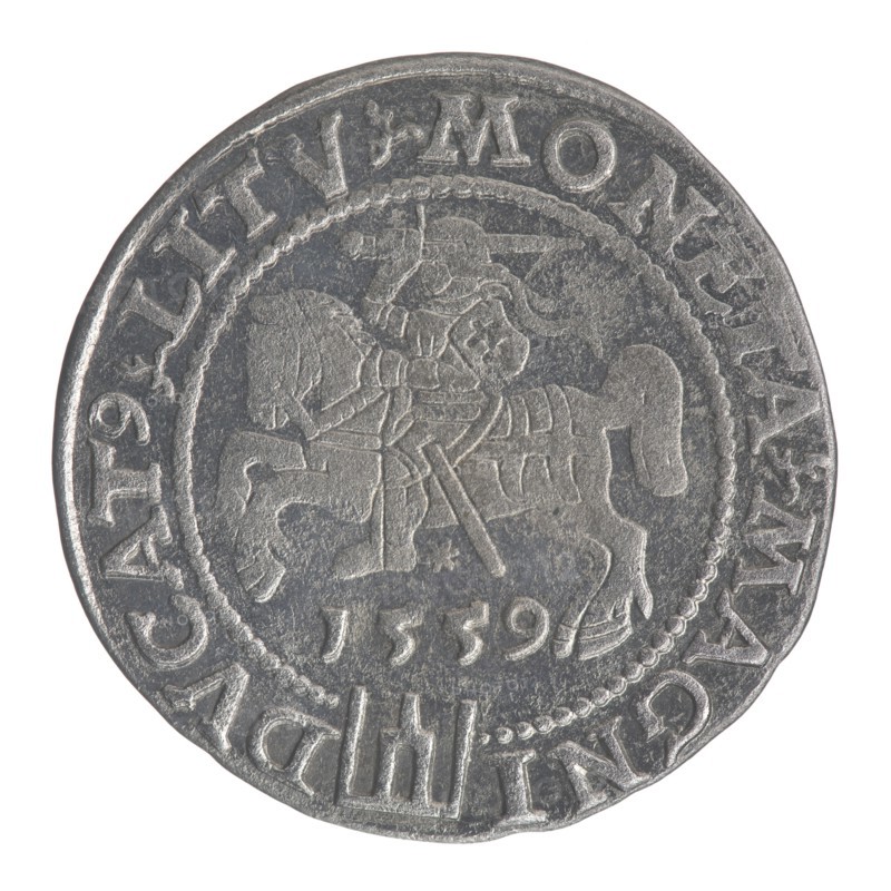 Lithuanian grosz on a Lithuanian foot, Sigismund II Augustus King of Poland; 1544–1572 author; coats of arms; Jagiellonians dynasty; royal bust iconography; Polish coins; Sigismund II Augustus 1520–1572 - iconography; male busts; Columns of Gediminas coat of arms of Lithuania; Pogon coat of arms; Lithuania. Obverse: Crowned male bust in armour with profile turned to the right, in the rim an inscription divided at the top by a crown cross: .SIGIS.AVG.REX.POL.MAG.DVX.LIT. Reverse: Lithuanian Pogon Pursuit facing left, below the date 1559 and the Columns of Gediminas coat of arms dividing the inscription in the rim: .MONETA.MAGNI - DVCAT9.LITV. Date: 1559. Mint: Vilnius. Country: Poland; Grand Duchy of Lithuania. Coin., A round metallic coin with a worn surface showing raised and recessed areas in shades of gray and silver, featuring an embossed central scene of a mounted figure on a horse with visible armor and a spear-like object, surrounded by a decorative beaded inner border and an ou...