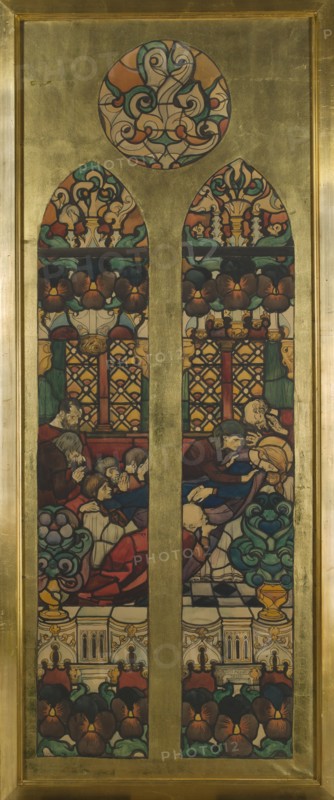 The Dormition of the Virgin Mary, cardboard for a stained glass window in the Grauer family burial chapel in Opava, by Józef Mehoffer 1869–1946; stained glass design, watercolor and drawing, 1901; subject: The Dormition of the Virgin Mary with apostles, saints, allegory Faithful Memory, pansies and floral symbolism mourning for the dead; neo-Gothic / Art Nouveau / Young Poland styles; materials: watercolor on cardboard; dimensions: height 186 cm, width 73 cm frame: height 196.0 cm, width 83.5 cm, thickness 4.8 cm., A tall rectangular stained glass panel set in a golden frame shows two arched window openings beneath a circular decorative medallion, all with swirling floral and geometric patterns. The design uses colors including gold, green, teal, red, orange, brown, purple, blue, black, cream, and beige. Within the two arched openings, stylized flowers and ornate latticework form the upper sections, while the lower sections depict a group of seated and reclining figures in layered clot...