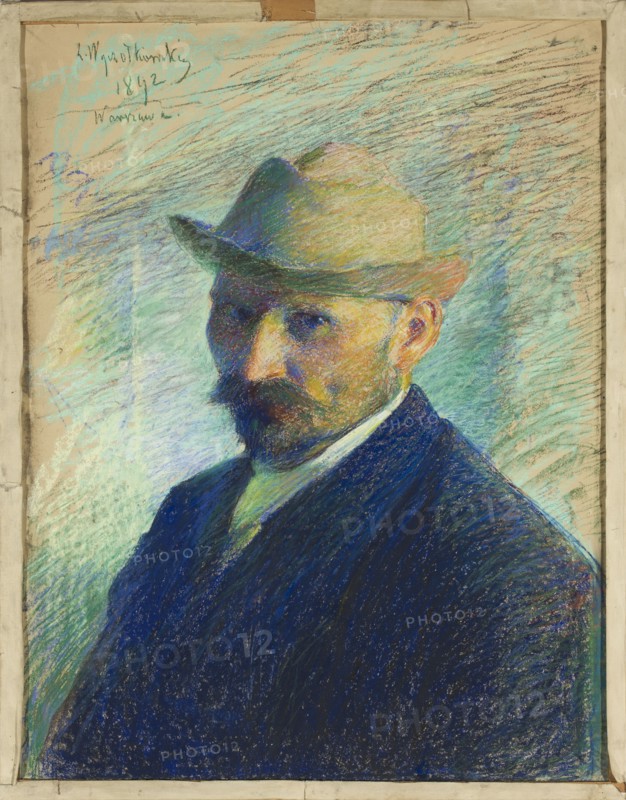 Self-portrait by Leon Wyczólkowski 1852–1936, pastel, 1892; portrait of a male; impressionist style; height 66.5 cm, width 52.5 cm; Poland., A portrait of a man shown from the chest up wearing a tan-brown hat and a dark blue jacket, with a darker beard and mustache and visible skin tones on his face and ear; the background consists of energetic, diagonal pastel strokes in shades of light blue, aqua, green, and tan, with areas of darker blue and purple near the figure; the man's shirt collar is a lighter color with a hint of green, and the overall image is framed by a beige border.