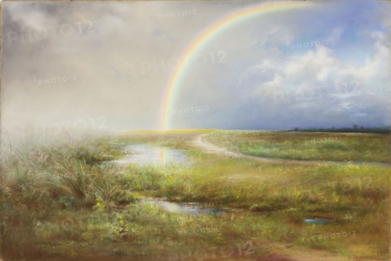 Landscape with a Rainbow, Józef Janowski ca.1859–ca.1938, painter. Pastel on paper, 1901. Subject: landscape with a rainbow. Dimensions: height 43.0 cm, width 62.5 cm. Materials/technique: pastel., A wide open marshy landscape under a vast cloudy sky with a bright rainbow arcing from the horizon and reflecting in a pool of water; the foreground shows wet grassy terrain with a few puddles and clumps of green and brown vegetation, a winding dirt path leads into the distance across a stretch of green and yellow-tinted grasses, the sky ranges from pale gray and cream on one side to blue and soft white clouds on the other, and the rainbow displays bands of soft colors against the sky.