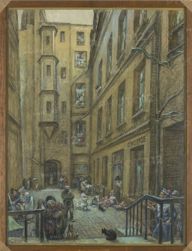 Courtyard of an old tenement house in Paris, Antoni Kamienski 1860–1933, painter, 1925, gouache and drawing, 66 × 50.5 cm, A narrow urban courtyard scene dominated by tall, textured buildings in shades of brown, ochre, beige, gray, and muted blue, with several windows and a few recessed balconies showing small groups of people; the ground is a cobbled or paved surface in gray and muted blue tones. In the foreground, a group of people and children in muted clothing gather and sit near steps and railings in brown and dark blue, with a black cat on the ground and a small brown dog nearby. Several figures stand or walk through the courtyard, some clustered near a dark archway at the rear and others near a doorway on the right; a few people lean from windows or balconies above. There are scattered small objects on the ground and a few dark and greenish pipes or cables running along the building façades, while the overall palette includes browns, tans, grays, muted blues, greens, and touches...