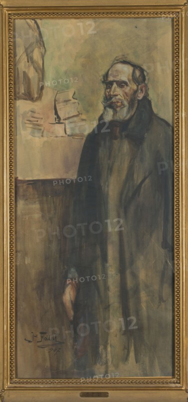 Portrait of a Brother, Julian Falat 1853–1929. 1907 drawing in watercolor, height 97.7 cm, width 44.7 cm. Depicts a male portrait, en pied, peasant subject., A framed vertical painting showing a standing older man with a beard and mustache wearing a dark cloak, rendered in muted tones of brown, gray, black, and touches of pale flesh and white on his face and beard, set against a background of washed greens, beiges, and light browns; a few loose abstract shapes in pale beige and green appear behind him, and the ornate frame is gold with beaded detailing.